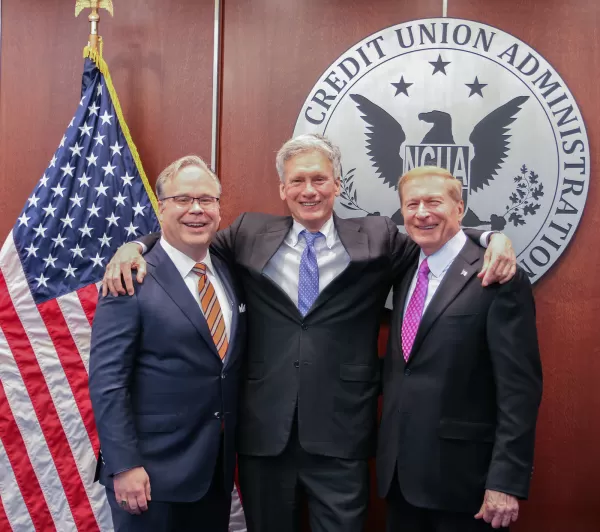 Board Members Todd M. Harper, Board Member J. Mark McWatters and former Board Member and Chairman Michael E. Fryzel.